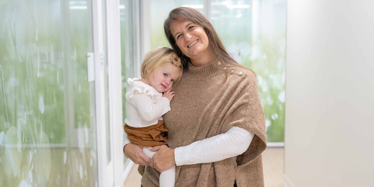 Whitney holds her daughter Jordan